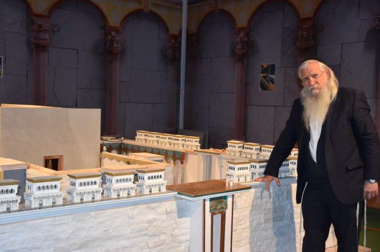 Rabbi Makover beside the model of the Third Temple at Mini Israel Park