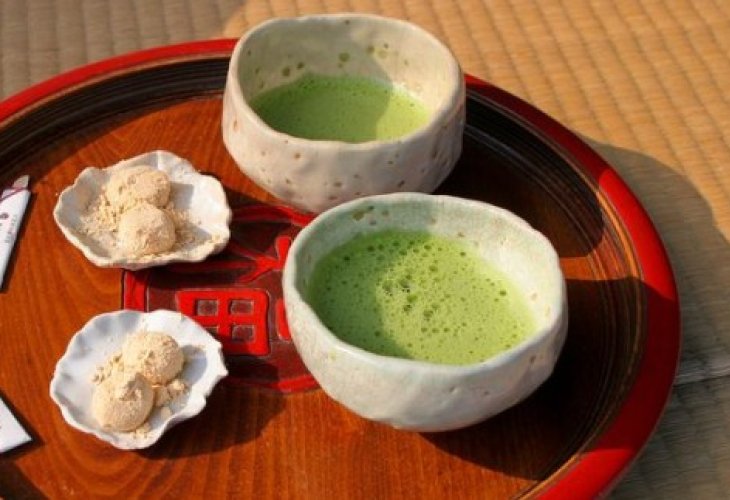Matcha tea served in traditional bowls in the East Matcha tea served in traditional bowls in the East