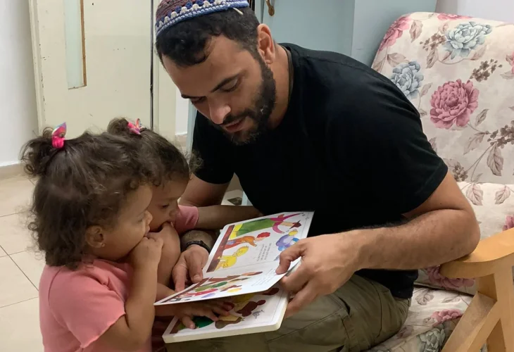 Yochai Glaam with his twin daughters (Photo courtesy of the family) Yochai Glaam with his twin daughters (Photo courtesy of the family)