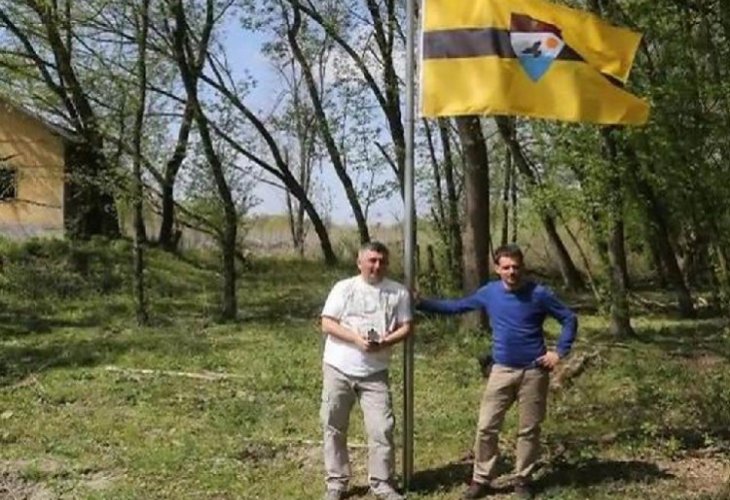 Hoisting the Liberland flag (illustration)