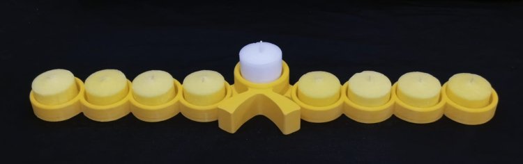 Menorah at the captives' headquarters, with the struggle symbol at its center