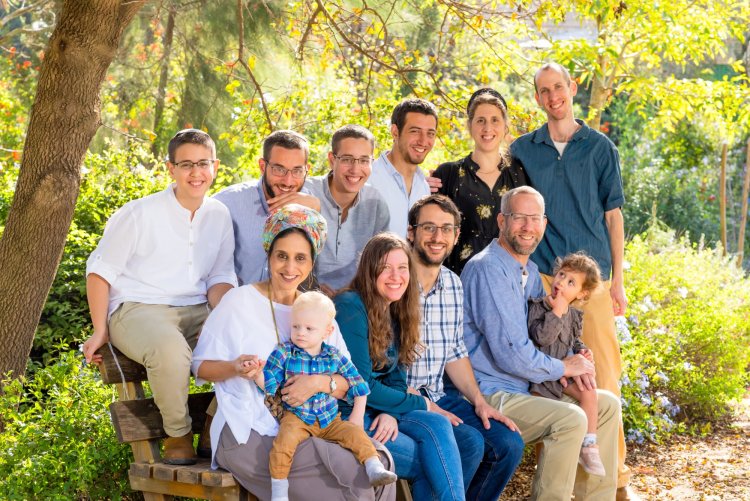 Eitan and his family (third from the right in the top row)