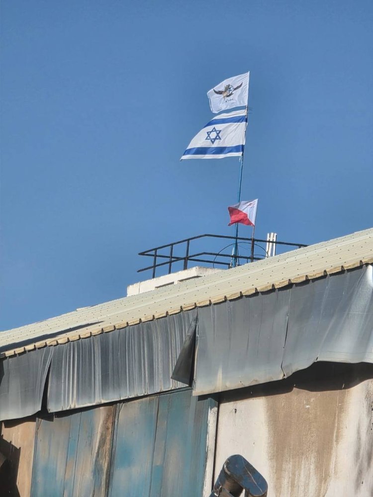 Israeli flag replacing UNRWA's at site (Used in accordance with 27a)