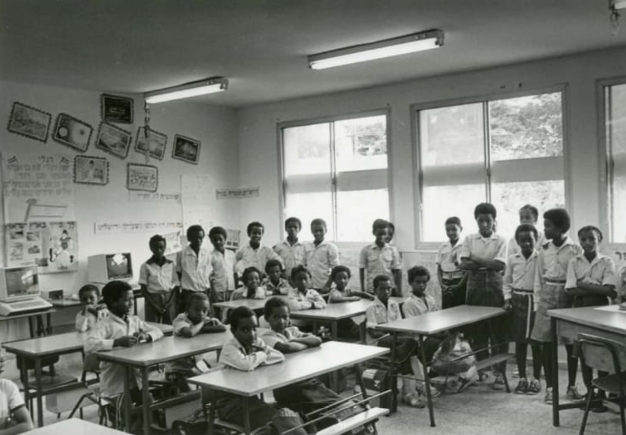 At the Atlit absorption center, Beit Yosef School. Shai Yasso is third from the left among the standing children.