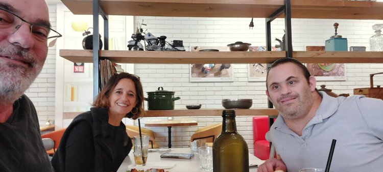 Yair with neighbors from the kibbutz who came to visit the cafe