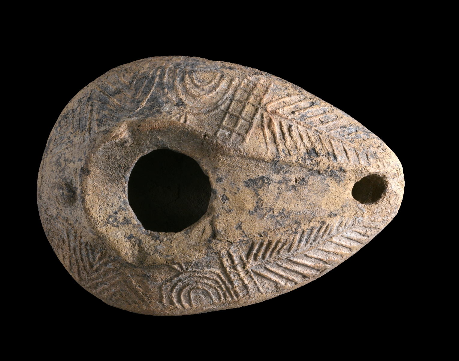 Lamp decorated with a menorah from Usha (Photo: Clara Amit, Israel Antiquities Authority)